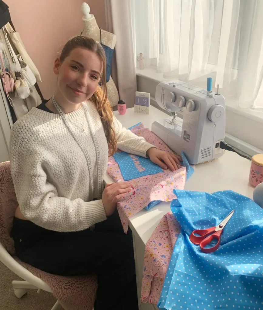 Lola at sewing machine